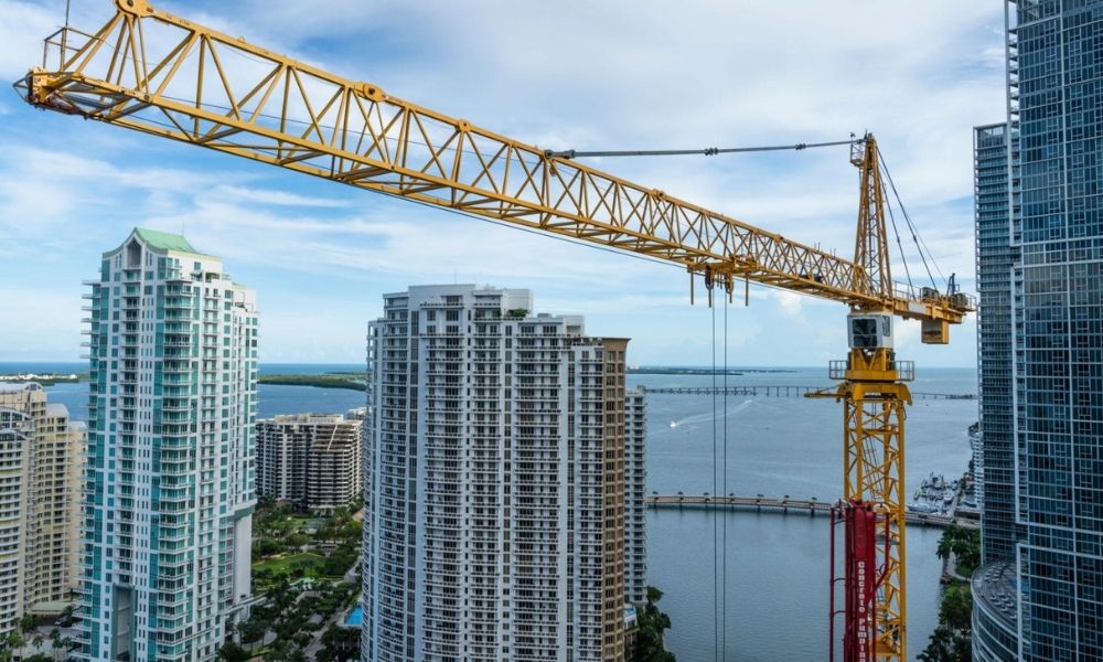 ALTA land survey context showing crane and high-rise buildings at a Miami construction site near the water