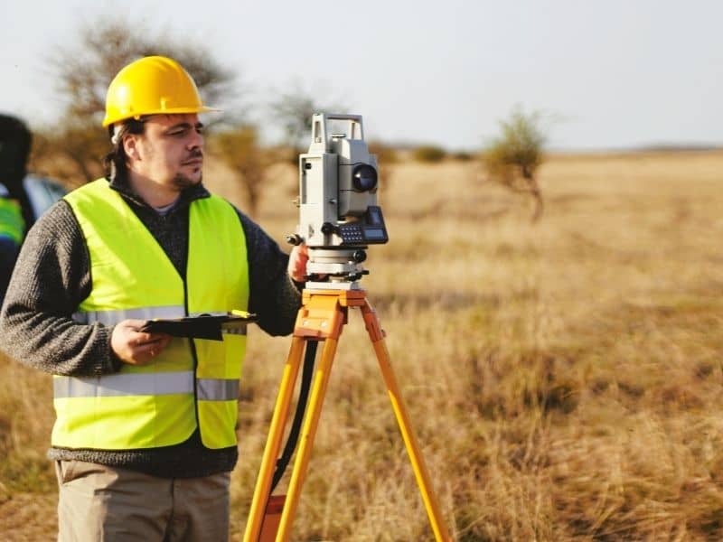 ALTA survey showing commercial property boundaries, access easements, utility easements, drainage areas, and existing improvements
